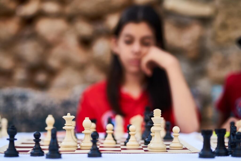Learn to focus-girl playing chess
