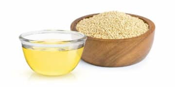 Quinoa and quinoa oil in different bowls
