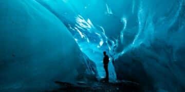 Foggy brain-person standing in ice cave during daytime