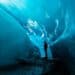 Foggy brain-person standing in ice cave during daytime