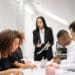Asian female boss talking to an employee in the meeting passive-aggressive boss