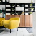 Yellow chair besides a showcase-how to manifest things in your life
