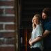 Man in blue shirt embracing women in grey shirt by the brick wall-ashwagandha benefits for sexual dysfunction