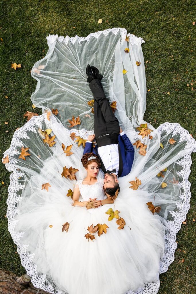 Married couple lying on grass-married couple
