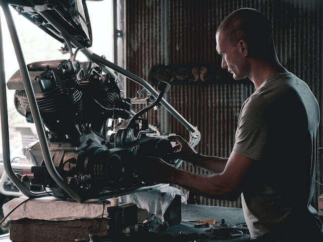 Repairer repairing a motor cycle engine-jobs best for introverts