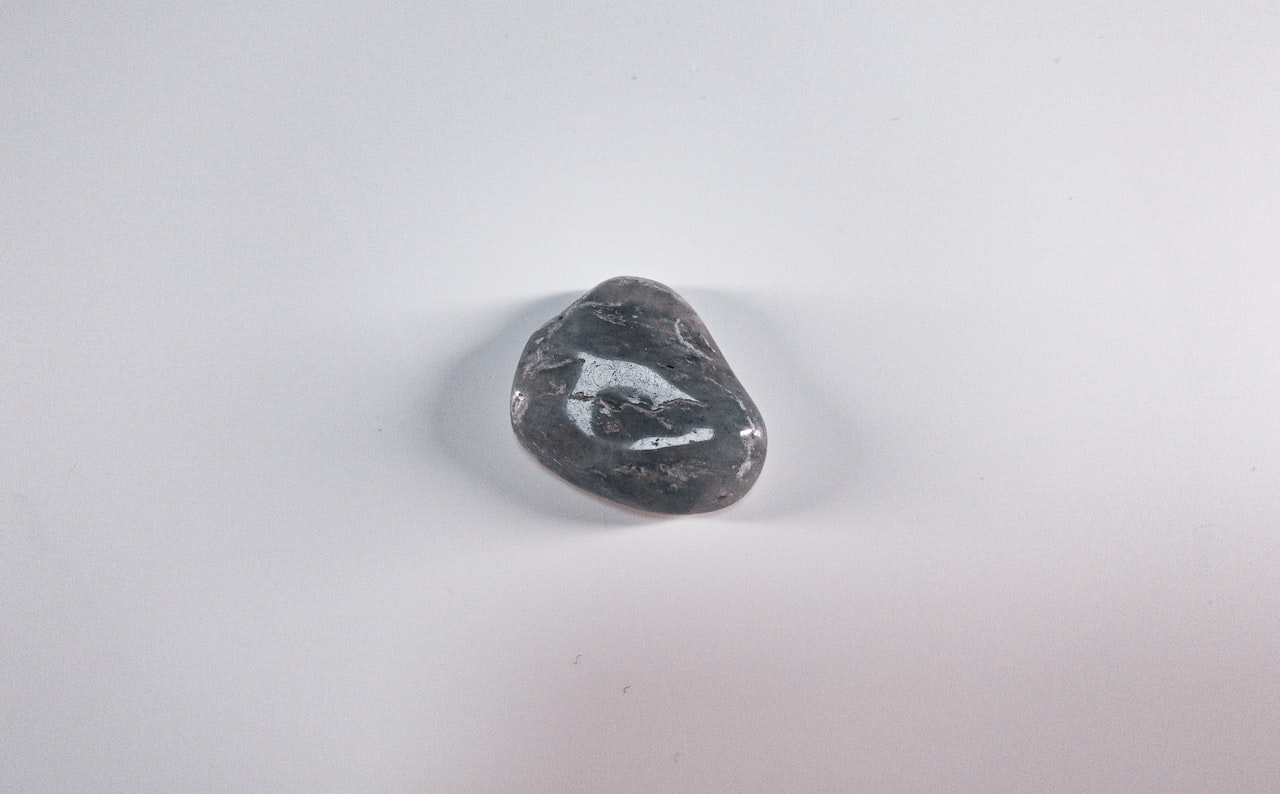 Black stone on white table