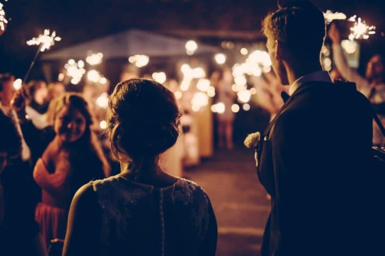 Man standing near the woman walking in party during nighttime-why do i hate parties